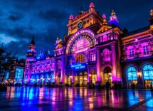 Logo Ferrovie dello Stato con sfondo Milano Cortina 2026